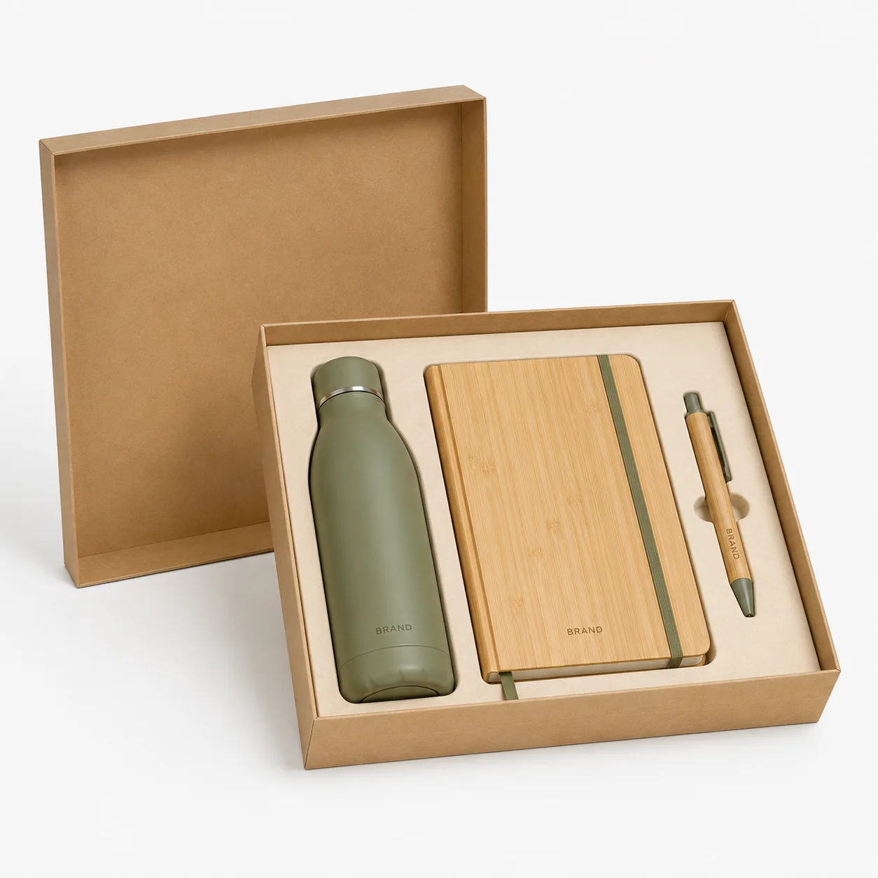 Open kraft gift box containing a reusable bottle, bamboo notebook and pen