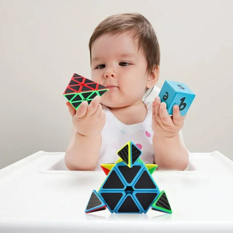 Child playing with a carbon fiber pyramid 3x3 demonstrating tactile engagement and interactive play
