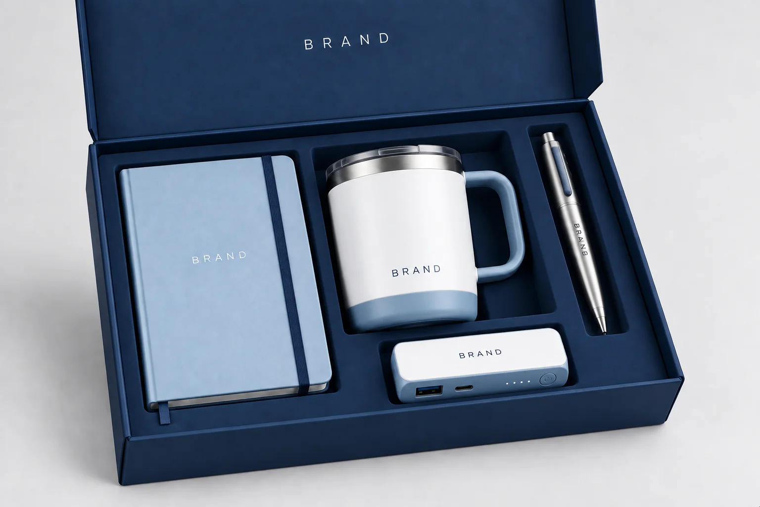 Client appreciation gift box with a travel mug, notebook, pen and charger
