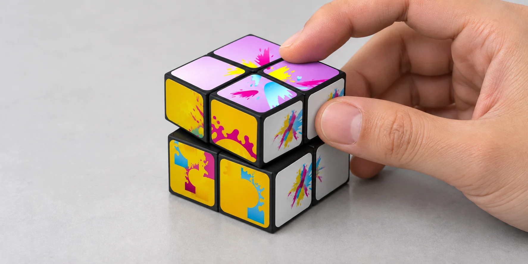 Hand rotating a custom 2x2 puzzle cube