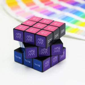 Custom promotional 3x3 rubiks cube displaying corporate logo branding on a clean background