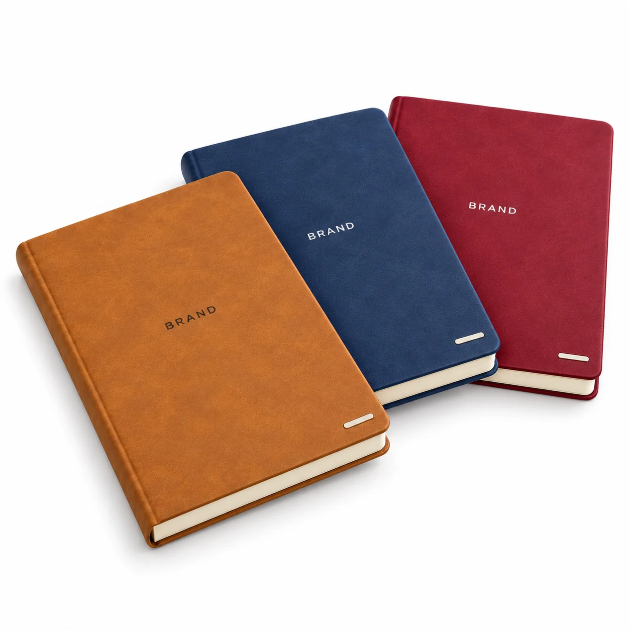 Three A5 PU hardcover journals in tan, navy blue and burgundy