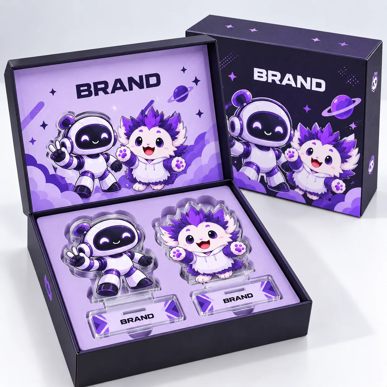 Open presentation box with two acrylic character standees beside a matching closed box.
