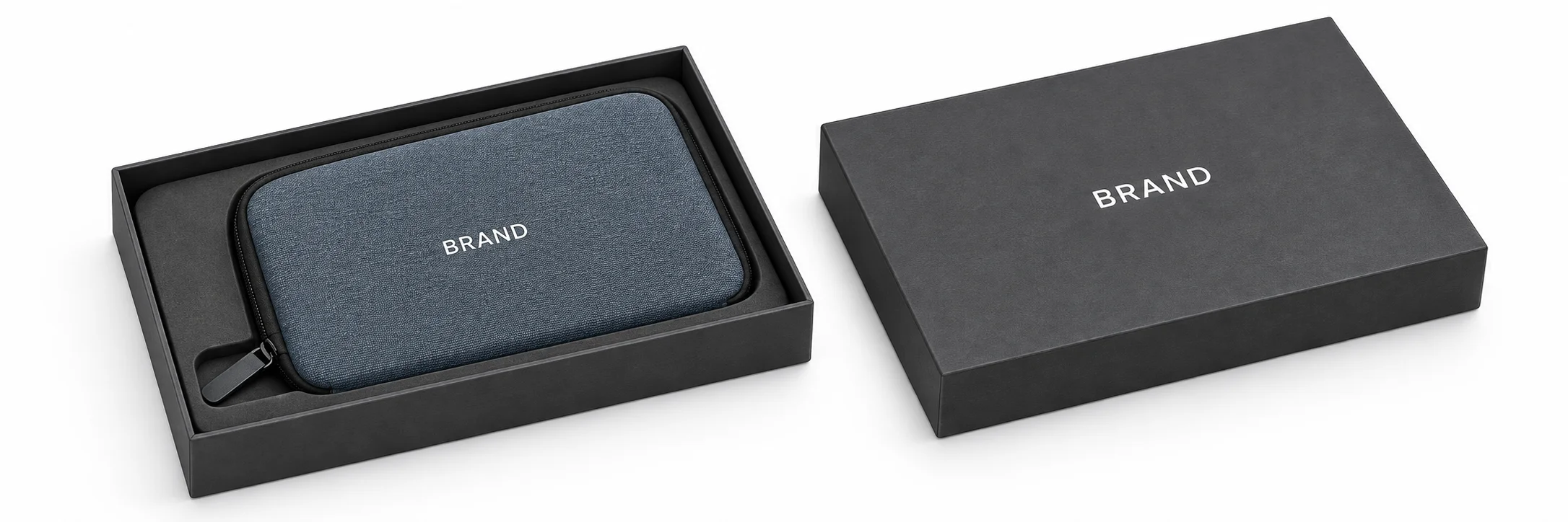 Blue-gray cable organizer with white lettering inside a fitted charcoal presentation box beside its lid.