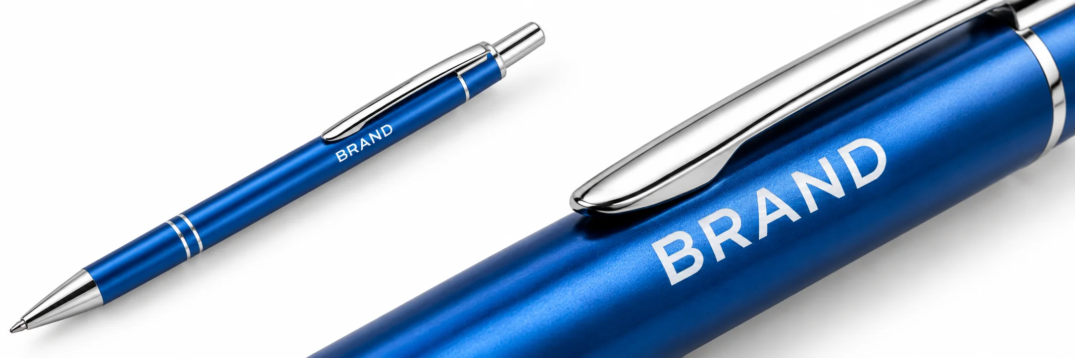 Custom lettering shown directly on a blue metal ballpoint pen barrel