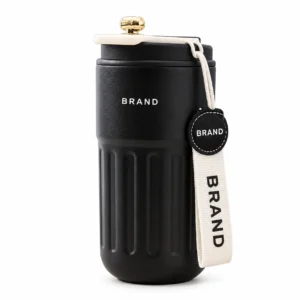 Black travel mug with a ribbed lower body, decorative lid and light fabric carry strap