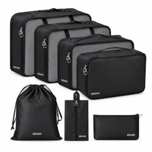 Black seven-piece packing set with four rectangular organizers, a drawstring bag, a slim handled bag and a small zipper pouch.