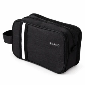 Closed black polyester toiletry bag with contrasting stripes, white lettering, zipper closure and side loop.